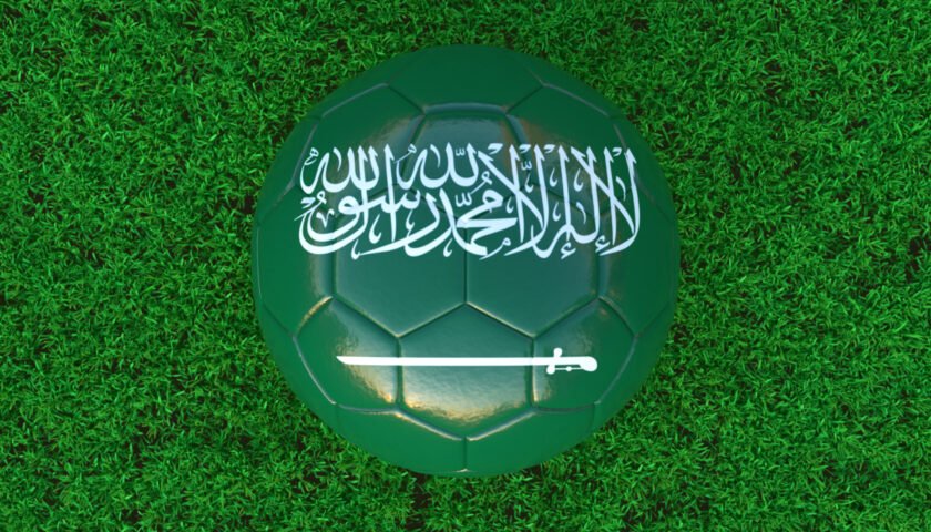 Roshn_saudi_league_Flag Of Saudi Arabia On Soccer Ball With Grass Background